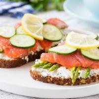 Smoked Salmon · A delicious breakfast sandwich with smoked salmon, cucumber, caper, tomato, and red onion, w...
