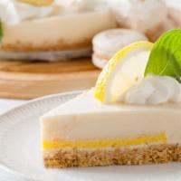 Lemon Eclipse · Eclipse shaped dessert on a short dough cookie base with lemon cream and a raspberry cream c...