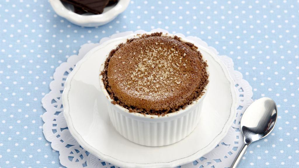 Chocolate Crème Brûlée · A buttery short dough tart shell filled with chocolate curls and crème brulée, sprinkled with granulated sugar topping, torched until caramelized, garnished with chocolate curls.