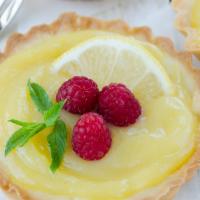 Raspberry · A buttery short dough tart shell filled with creme patissiere, topped with fresh raspberries...