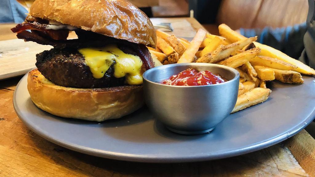 Beyond Burger · ~Vegetarian~ 'Beyond' vegan protein patty, fresh lettuce, tomato, onion, garlic infused aioli, toasted  brioche bun. With choice of Fries or House Salad.
