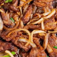 Mongolian Beef · Spicy. Sliced tender beef sautéed with green onion and yellow onion.