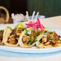 Regular Tacos · Choice of meat, cilantro, onion and salsa.