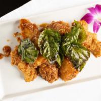 9. Angel Wings · Top menu item. Deep-fried chicken wings sauteed with chili garlic sauce and topped with cris...