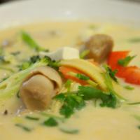 36. Tom Kha Pak Soup · Vegetarian. Hot and sour vegetable soup with coconut milk, lemongrass, mushrooms, onions, to...