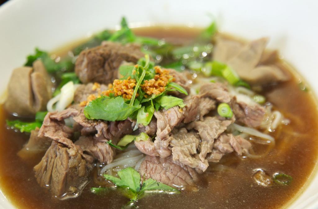 83. Beef Noodle Soup · Noodle soup with sliced beef, beef balls, beef stew, and tripe. Served with choice of noodles.