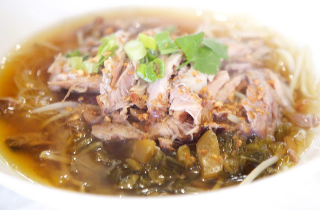 92. Pork Leg Stew Noodle Soup · Specialty pork leg stew noodle soup with pickle mustard and bean sprout. Served with choice of noodles.