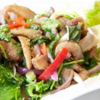 29. Yum Kor Moo Yang Salad · Grilled pork shoulder salad with spicy lime dressing, onions, mint leaves, and rice powder.