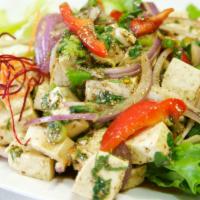 30. Larb Tofu Salad · Soft tofu salad with chili, onions, rice powder, cilantro, and lemon dressing.