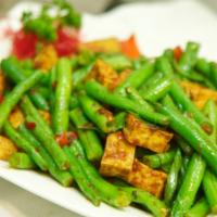 135. Tofu Prig King · Vegetarian. Crispy tofu sautéed with green beans, chili paste, and basil.  Add rice, a la ca...