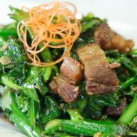 47. Kao Kana Moo Krob · Sautéed crispy pork belly with Chinese broccoli over rice. Also available a la carte. Add ri...
