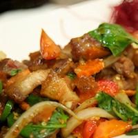 48. Kao Ka-Prow Moo Krob · Sautéed crispy pork belly with chili, onions, bell peppers, and basil over rice. Also availa...