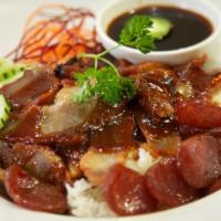 42. Kao Moo Dang · Roasted pork and Chinese sausage over rice and topped with chef's secret gravy sauce. Also a...