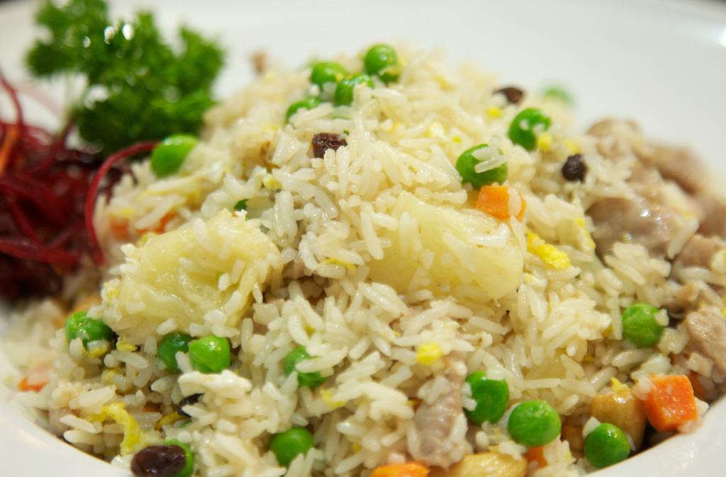 99. Pineapple Fried Rice · Top menu item. Fried rice mixed with pineapple, eggs, cashew nuts, raisins, onions, carrots, and choice of meat. Add pork, chicken, beef, shrimp, seafood, meat  for an additional charge.