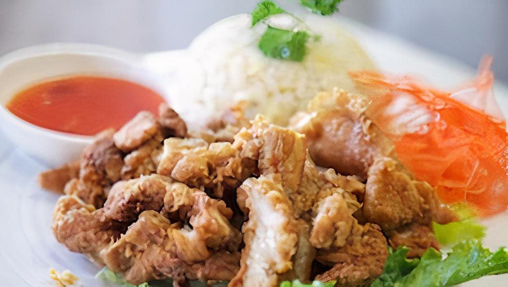 102. Crispy Chicken with Fried Rice · Fried rice with chicken, served with sweet and sour sauce.