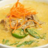 62. Gang Panang Nuer · Beef in medium red curry and fresh basil. Made with coconut milk. Add rice, a la carte for a...