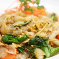 74. Pad Kee-Mao Noodles · Pan-fried flat rice noodles with your choice of beef, pork, or chicken with onions, chili, C...