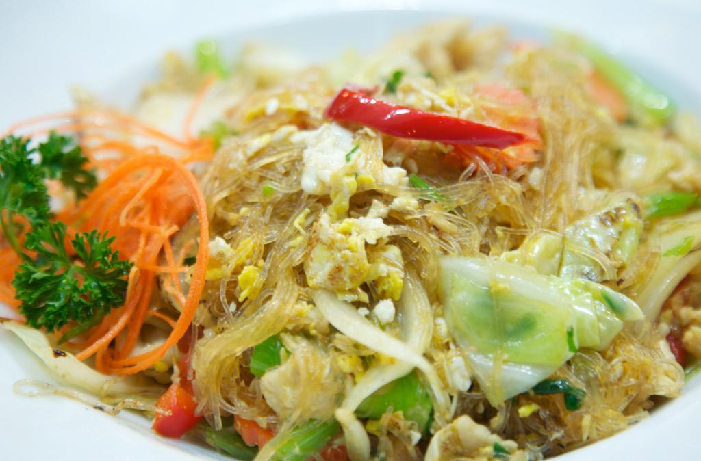 80. Pad Woon Sen Noodles · Stir fried silver noodles with Napa cabbage, tomatoes, celery, onions, egg, and your choice of chicken, pork, or beef.
