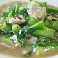 73. Rad Na Noodles · Flat rice noodles topped with your choice of beef, pork, or chicken with Chinese broccoli in...