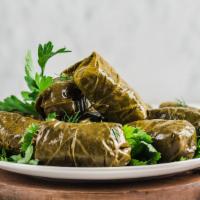 Exotic Dolma · Vegan, gluten free, vegetarian. Grape leaves stuffed with rice and herbs.  (4 pieces).