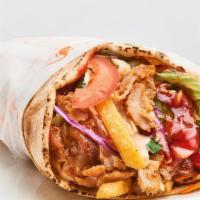 Lamb Gyro Wrap · Gyro with lettuce, tomatoes, pickles and tzatziki sauce.