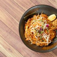 (V)Pad Thai. · Rice noodles, peanuts, bean sprouts, green onion tossed in a wok with house made tamarind pa...