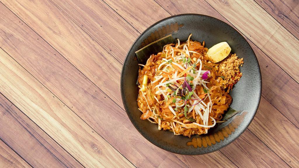 (V)Pad Thai. · Rice noodles, peanuts, bean sprouts, green onion tossed in a wok with house made tamarind pad thai sauce. Crushed chili flakes on the side. *GLUTEN FREE NOT AVAILABLE*