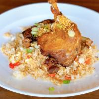 Crispy Duck Fried Rice · Fried steamed jasmine rice with eggs, onion, carrot, red bell pepper and crispy duck topped ...