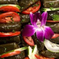 3. Dolma · Fresh herbs, onion, and rice seasoned wrapped in grape leaves.