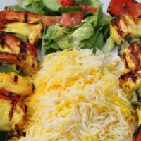 25. Chicken Breast Kabob · Skewer of tender pieces of chicken breast marinated in special served with rice and grilled ...