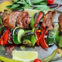 23. Shish Kabob · Pieces of marinated meat and vegetables cooked and served on skewers.