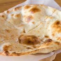Plain Naan · Baked in traditional  clay oven.