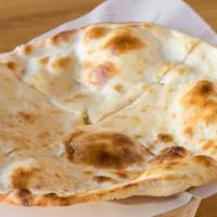 Honey Naan · Baked in traditional clay oven.