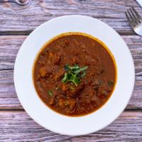 Lamb Curry · Boneless Lamb cooked with homemade herbs and spices in curry sauce.