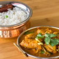 Chicken Curry · Boneless chicken thigh cooked with homemade herbs and spices in curry sauce. Served with rice.