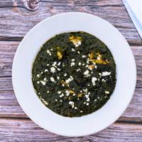 Saag Paneer · Finely chopped spinach cooked with chunks of homemade cheese (paneer), special herbs and spi...