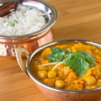 Pharsi Chana · Organic Pumpkin and Garbanzo beans cooked with special herbs and spices.