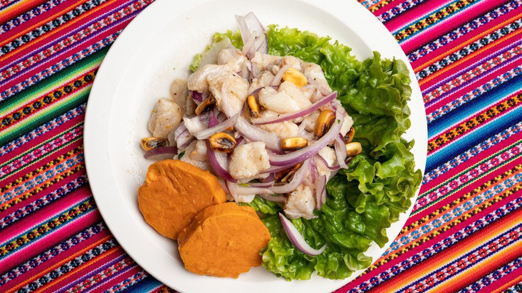 Ceviche de Pescado · Fresh wild fish in spicy tiger’s milk, Served with Sweet Potatoes and Cancha( Toasted corn).
