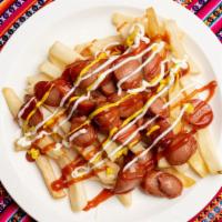 Salchipapa · French fries, hot dog with served salads.
