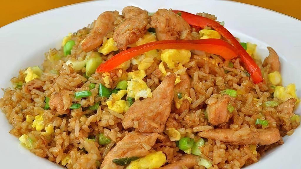 Arroz Chaufa De Pollo · Chifa style dish a mix of peruvian and chinese cuisine. mix of fried rice with vegetables usually including scallions eggs and chicken quickly cooked at a high flame often in a wok with soy sauce and oil. it is derived from chinese cuisine due to the influx of chinese immigrants to peru.