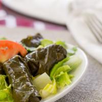 2. Dolmas (6 Each) · Grape leaves stuffed with rice, onions, mint, and spices.