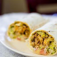 24. Chicken Shawarma Wrap · Seasoned, slowly roasted chicken, shaved thinly, and served with lettuce, tomatoes, parsley,...
