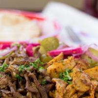 25. Combo Shawarma Wrap · Seasoned, slowly roasted lamb, and chicken, shaved thinly, and served with lettuce, tomatoes...