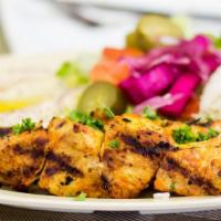 26. Chicken Shish Kabob Wrap · Tender marinated chicken on a skewer char-broiled then pulled onto lavash bread with lettuce...