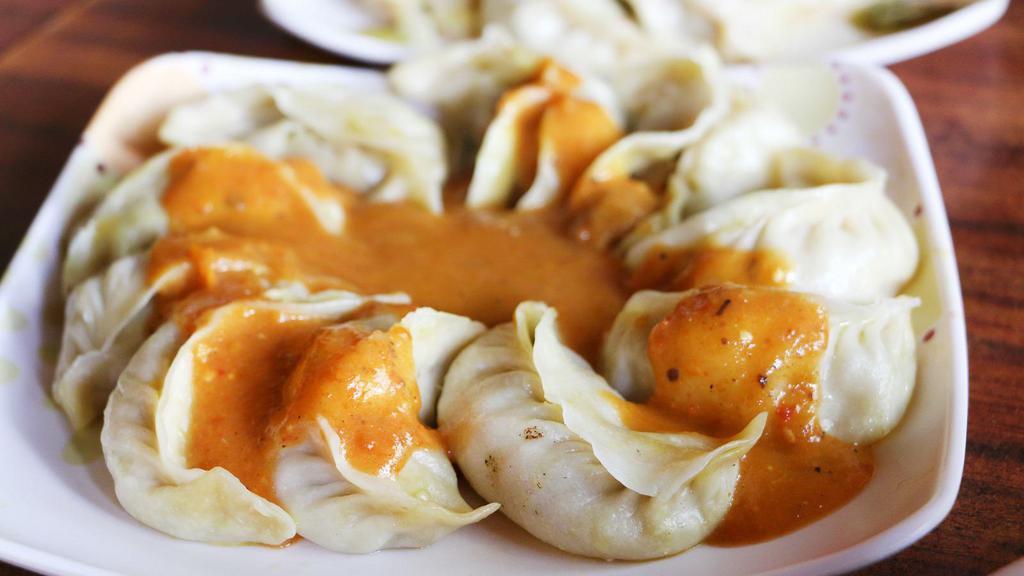 Chicken Momo's · Classic Nepali momo's made with chef's special sauce.