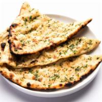 Garlic Naan · Clay oven made bread topped with garlic.