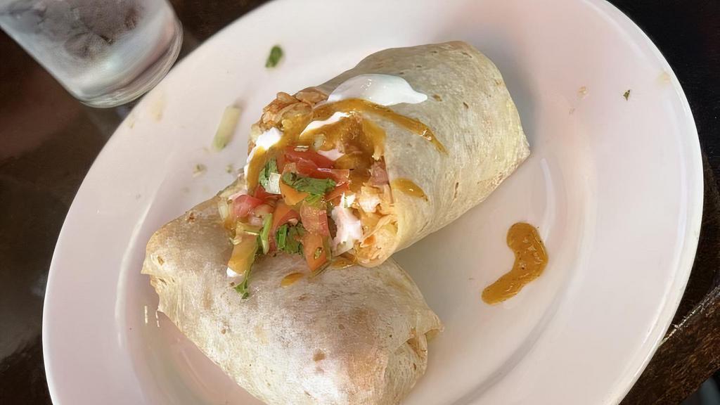 Chicken (Pollo) Burrito · Cooked vegetables & salsa. Include rice, beans, guacamole, cheese, sour cream, lettuce and salsas.
