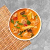 Panang Curry Shrimp · Shrimp simmered in panang curry, coconut milk, pea and bell pepper. Medium.