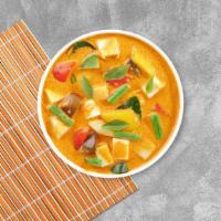 Yellow Curry Tofu · Yellow curry tofu simmered with tomatoes, potatoes, coconut milk and sweet onion. Medium.