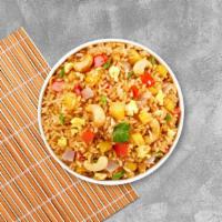 Pineapple Fried Rice (Chicken & Shrimp) · Pineapple fried rice with egg, onion, cashew nut and Thai spices.